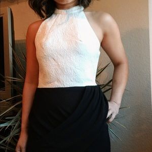 Black and white halter backless dress.